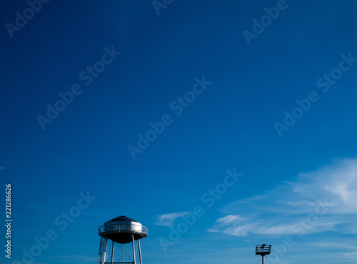 Top parts of the water and light towers. Selective focus. Copy space.