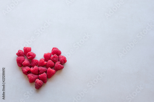 Obraz na plátně Heart shaped raspberries