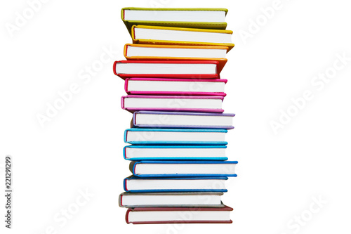 Books. A lot of books with bright covers in one vertical pile isolated on white background. Place for text. Design element, paper and leather texture. Colorful books on the shelf, close up