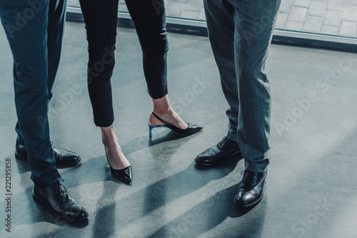 cropped shot of group of successful business people at modern office