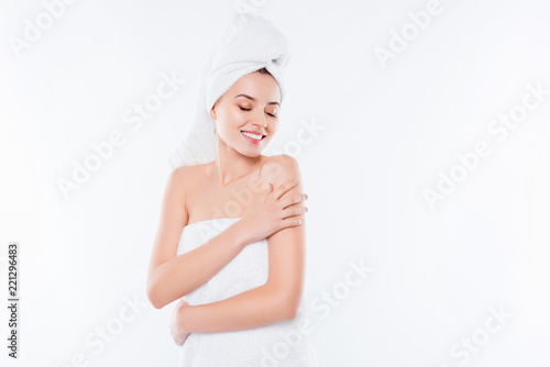 Portrait of charming sensual girl after shower with towel on hea