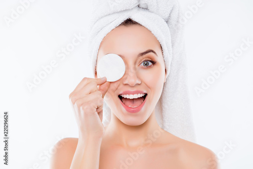 Portrait of foolish playful woman using sponge for application o