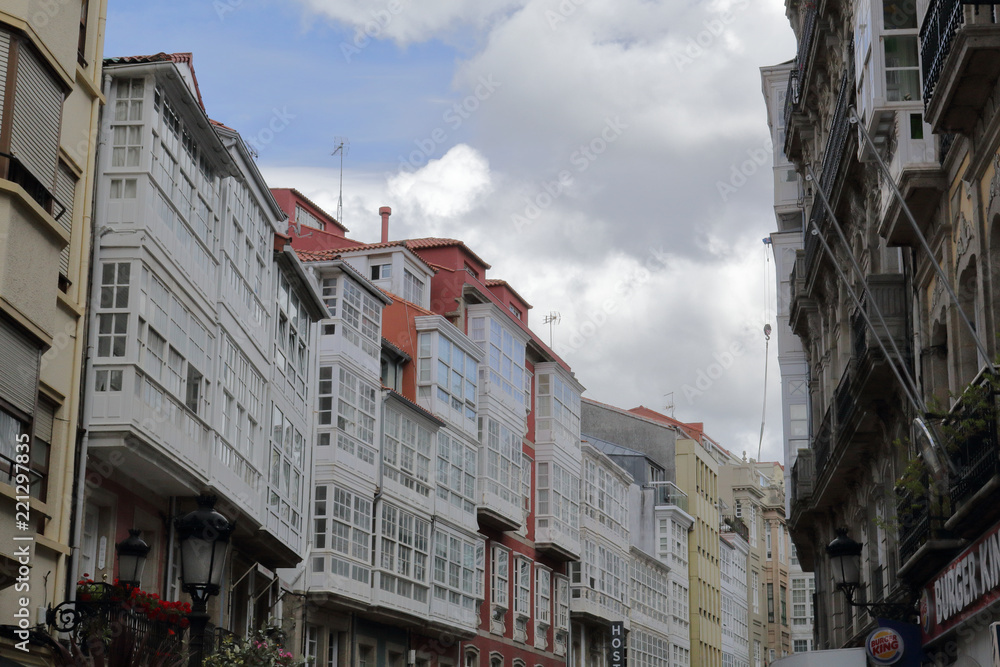 Typical Galician galerias, white enclosed balconies made of wood and glass, in the capital city La Coruña