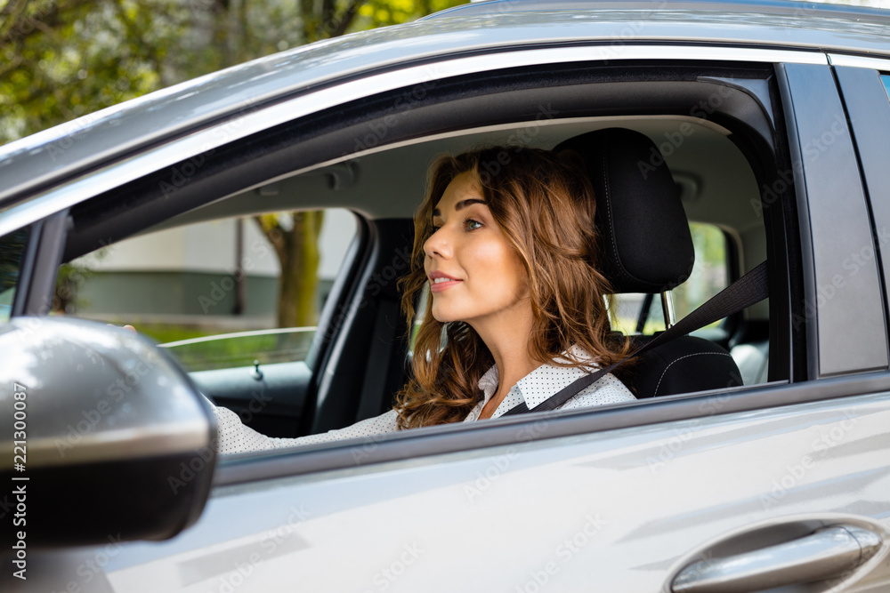 Smiling businesswoman driving a car Smiling businesswoman driving a car