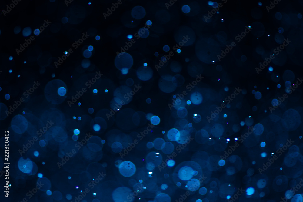 Abstract blue bokeh with black background Abstract blue bokeh with black background
