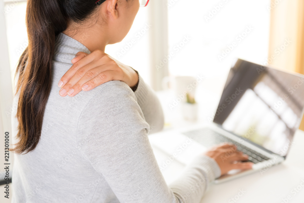 Closeup woman with hands holding her shoulder pain. Office syndrome and Health care concept. Closeup woman with hands holding her shoulder pain. Office syndrome and Health care concept.