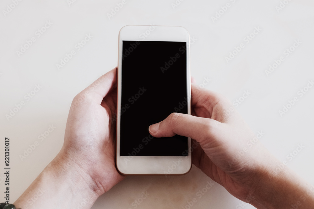 hand holding smart phone isolated on white hand holding smart phone isolated on white