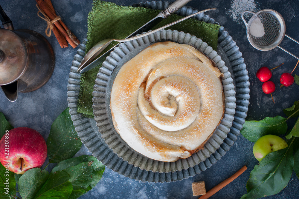 Vertuta, traditional Romanian, Moldavian or Balkan baking with apples . Rustic style, selective focus. Vertuta, traditional Romanian, Moldavian or Balkan baking with apples . Rustic style, selective focus.