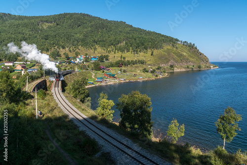 The old steam locomotive is driving along the Circum-Baikal Railway photo