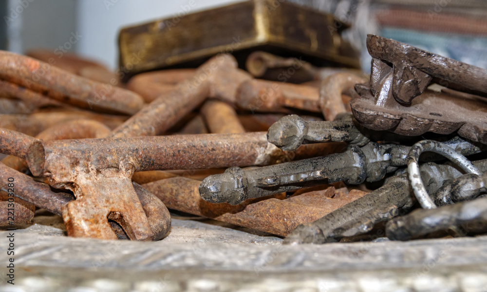 Old rusty metal keys of different shapes
