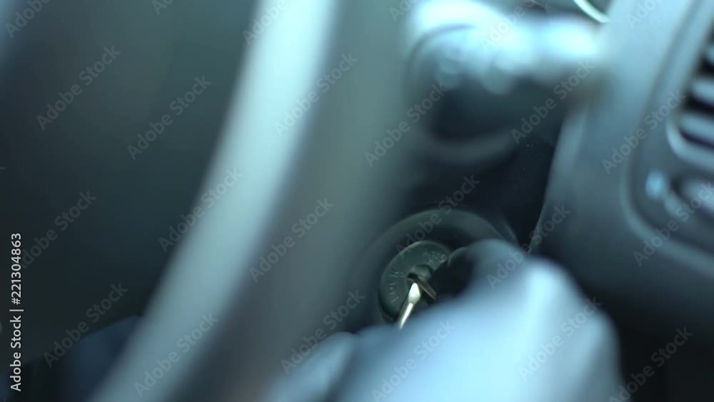 Criminal starting car engine with tools, lock picking, carjacking in city Criminal starting car engine with tools, lock picking, carjacking in city
