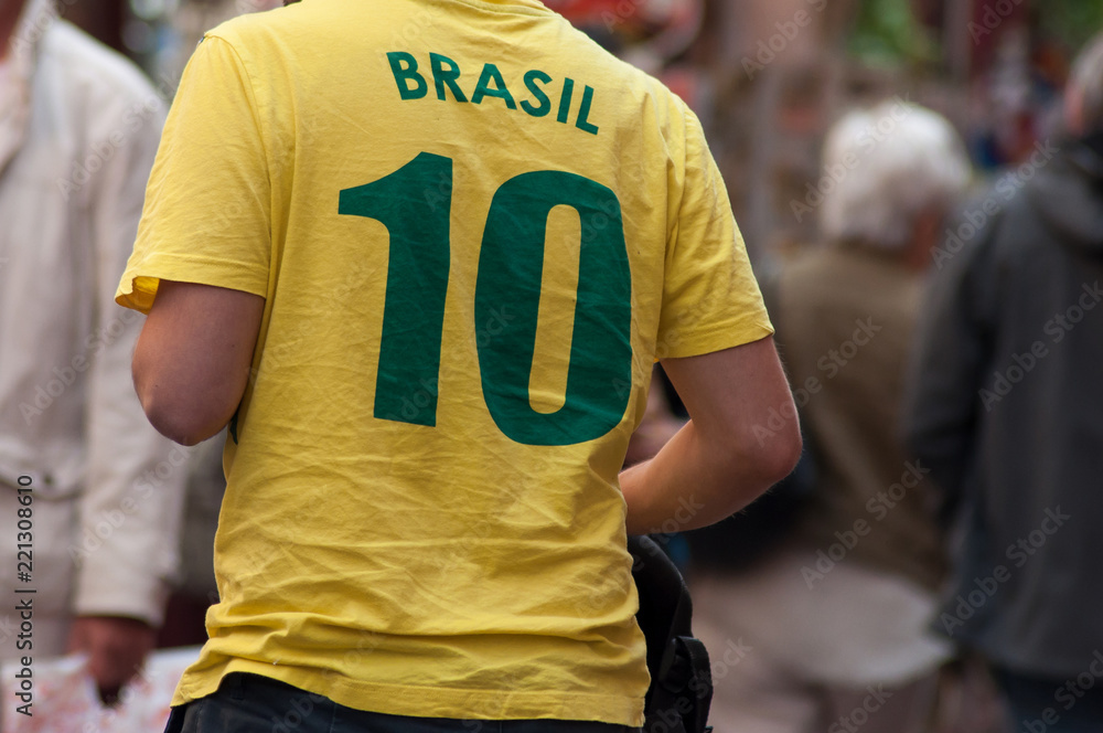 Naklejka premium retail of brasilian soccer tee shirt on man in the street on back view