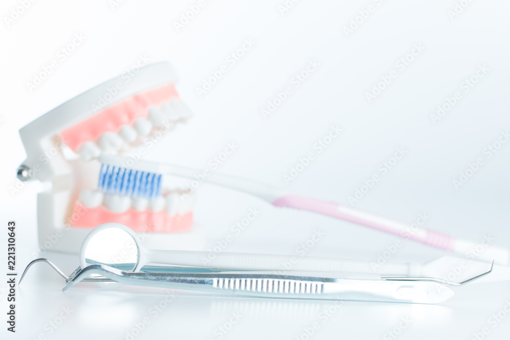 Dental model with dental equipment in oral health concept. Dental model with dental equipment in oral health concept.