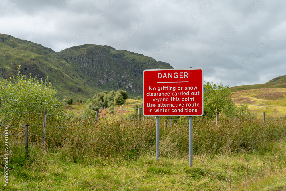 A winter weather warning sign on a minor road in the Ben Lawers mountain range in Perthshire in the Scottish highlands.