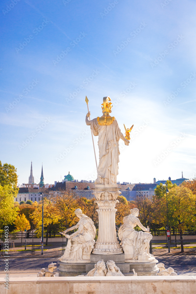 Naklejka premium Picturesque autumn view on old town of Vienna from the historic building of the austrian parliament. Sculpture of Pallas Athene Fountain