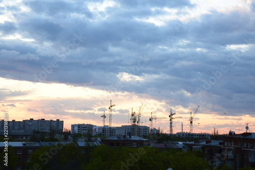 sunset over house construction