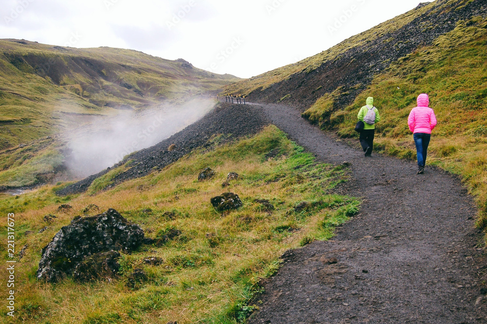 Two tourist walking at Valley of Reykjadalur