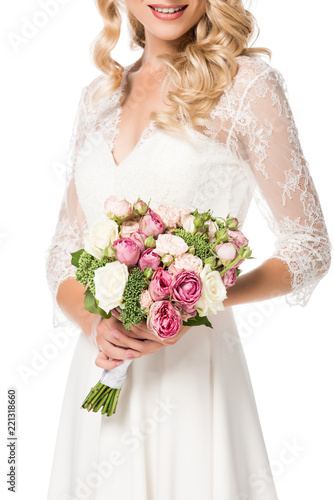 cropped shot of smiling bride holding bouquet isolated on white