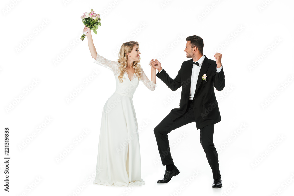 beautiful young bride and groom dancing and looking at each other isolated on white beautiful young bride and groom dancing and looking at each other isolated on white