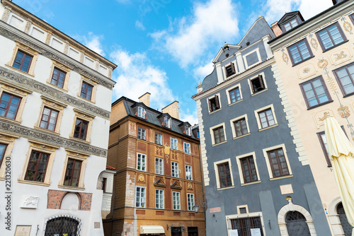 Warsaw / Poland - August 20 of 2018 : Street with colorful houses in Warsaw city. European architecture of old town in Poland. Concept of travel and city landscape.