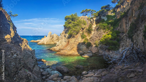 Wild seascape of bay in Mediterranean sea on clear sunny day. Amazing view of rocky shores against blue sky and coastline. amazing sea nature of Costa Brava, Spain. Landscape of Bay in Lloret de mar.