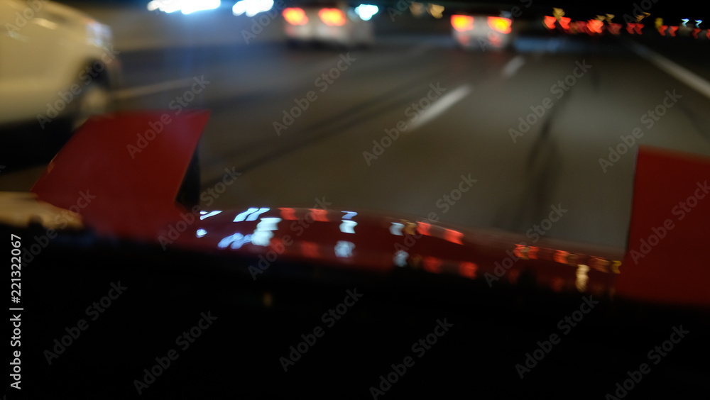 red Japanese vintage car at night
