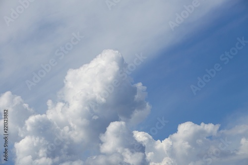 Amazing cumulus clouds and sunlight on the background of clear blue sky, Summer in GA USA.