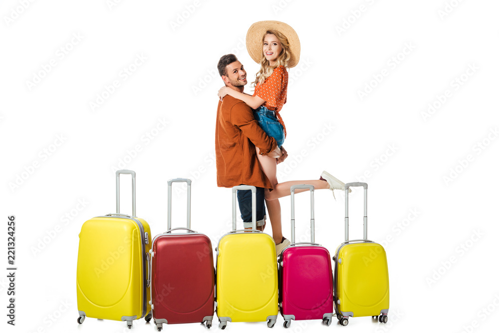 side view of man holding girlfriend on hands with suitcases around isolated on white side view of man holding girlfriend on hands with suitcases around isolated on white
