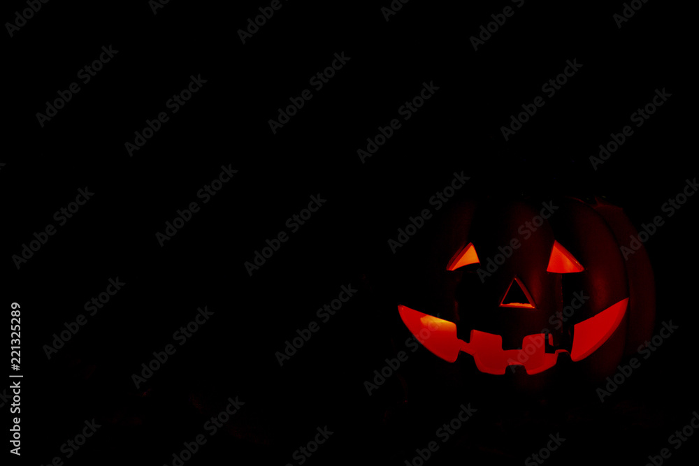 Pumpking iluminated on the darkness. Halloween cocept