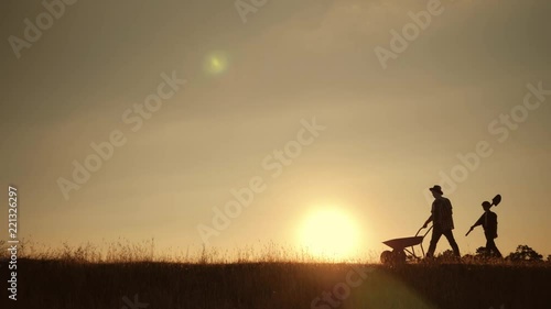 Wallpaper Mural Happy family father and son harvesting in the field at sunset Torontodigital.ca