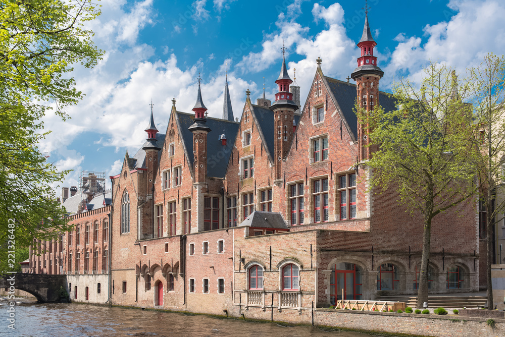 Fototapeta premium Bruges in Belgium, beautiful typical houses on the canal