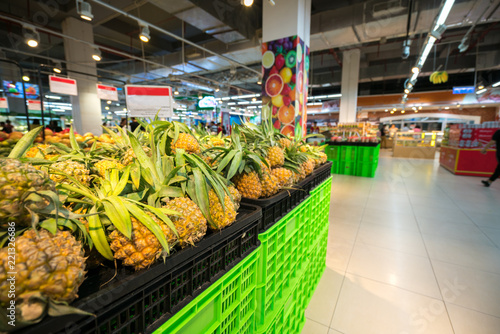 Fresh pineapple on shelf in supermarket.