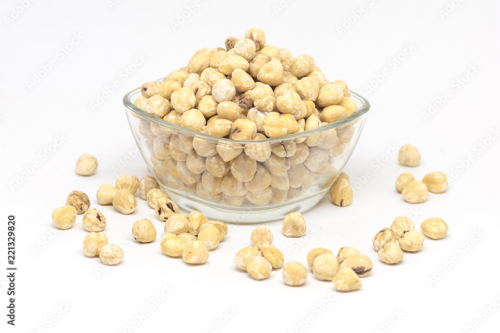 bowl with raw hazelnuts kernels on white background bowl with raw hazelnuts kernels on white background