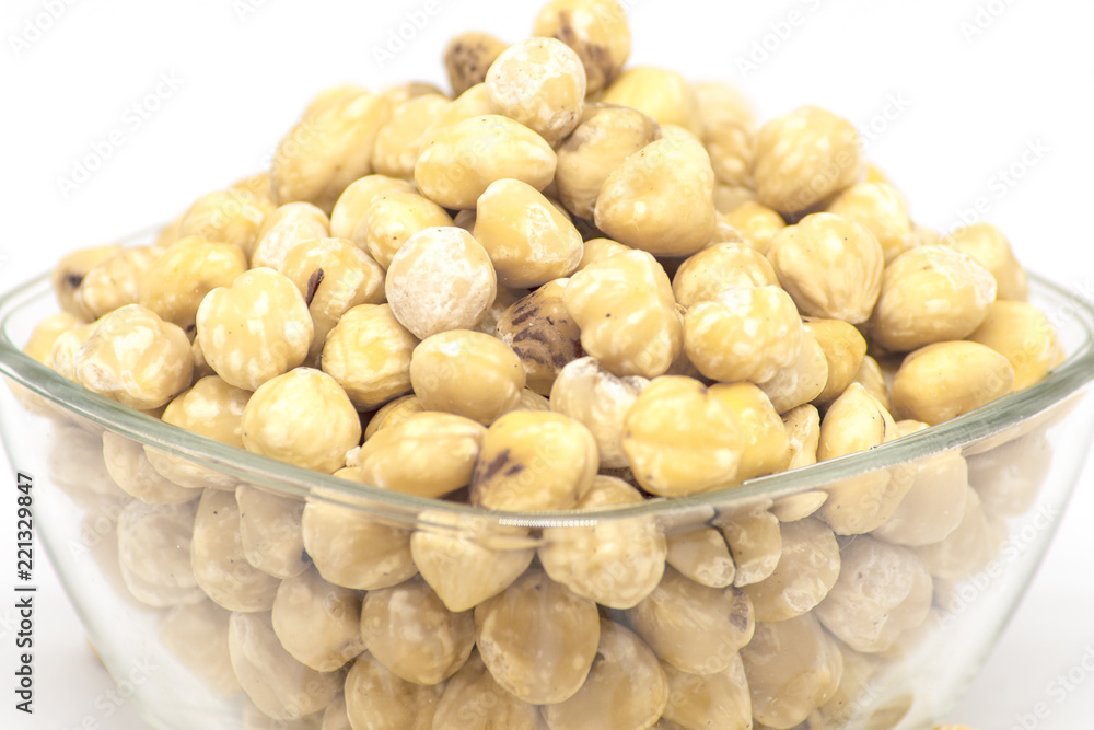 bowl with raw hazelnuts kernels on white background bowl with raw hazelnuts kernels on white background