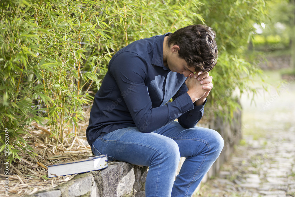 Businessman praying outdoor Businessman praying outdoor