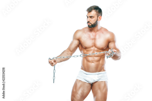bodybuilder posing. Beautiful sporty guy male power. Fitness muscled manin white lingerie. on isolated white background. Posing with chain