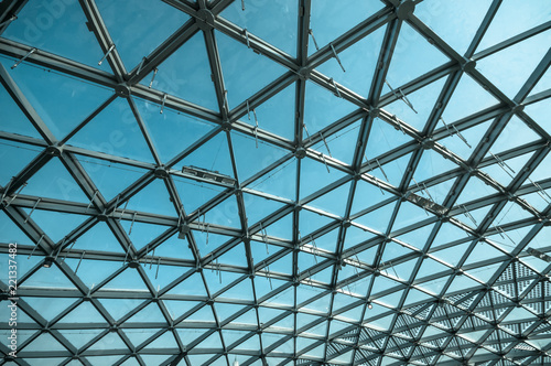 Transparent glass ceiling on blue sky background