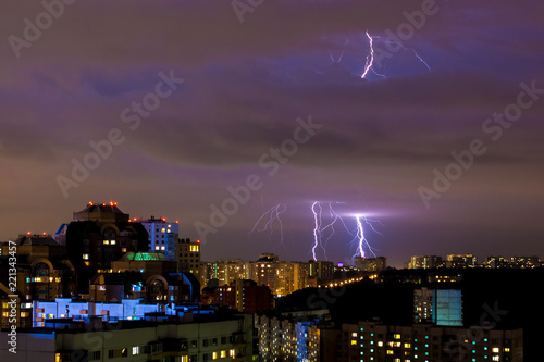 bright strikes of lightning during an evening thunderstorm in Moscow