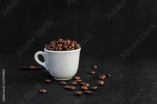 White Coffee Cup Filled with Coffee Beans