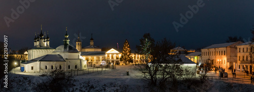 Suzdal, Russia. Pyatnitskaya church and Shopping arcade Gostiny Dvor of Suzdal Kremlin at night in winter