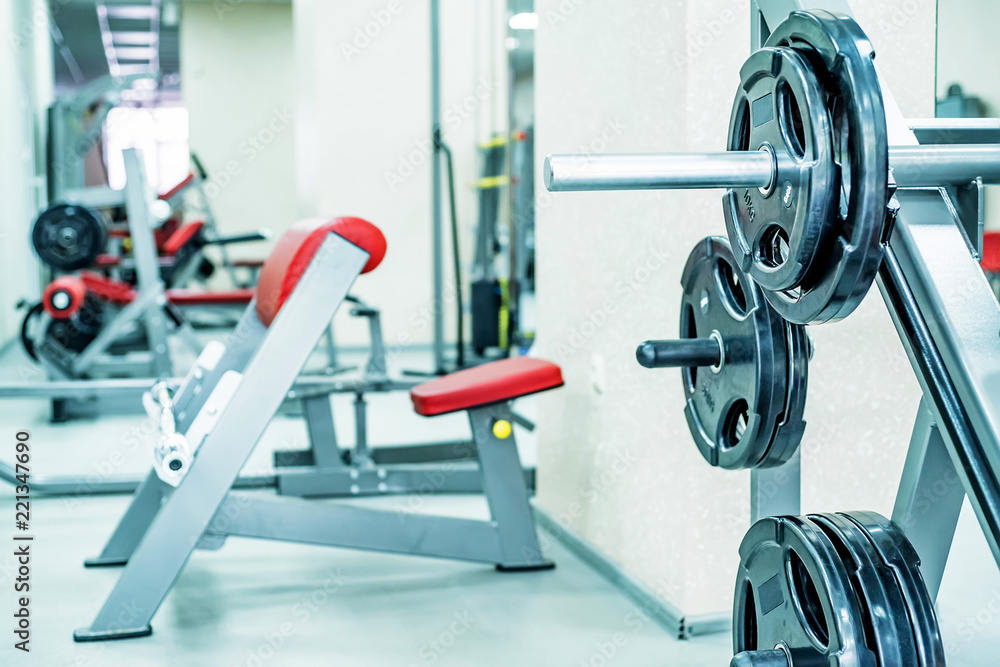 New fitness machines in modern gym interior