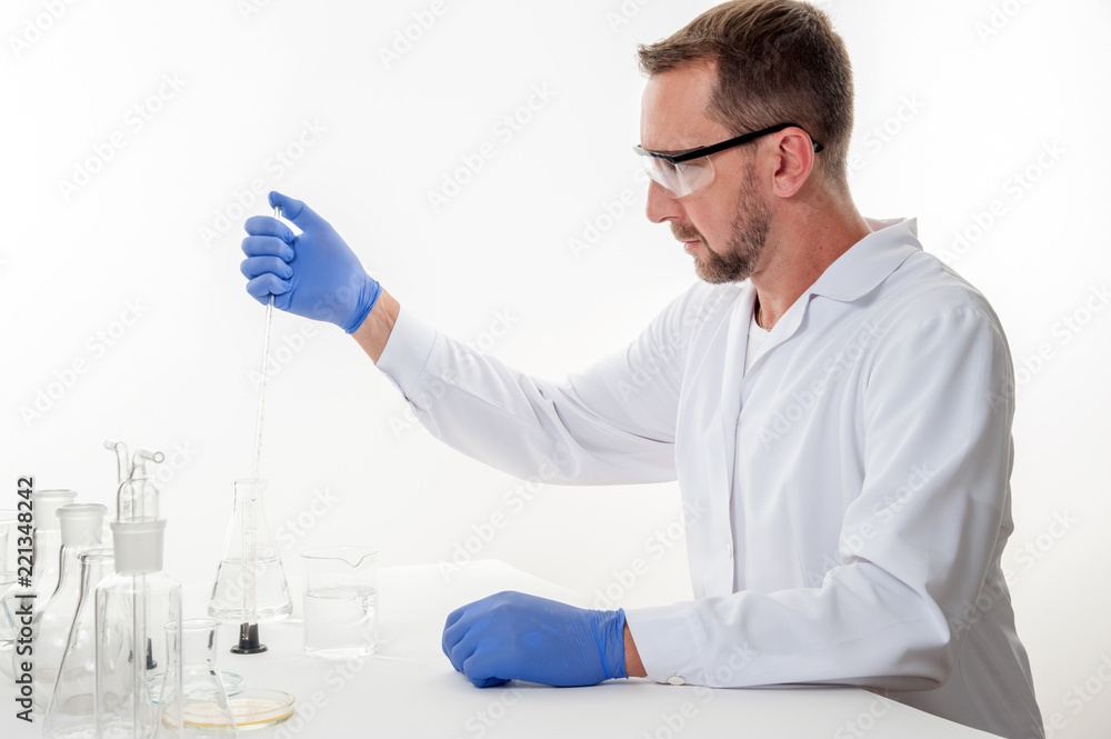 man in the laboratory / view of a man in the laboratory while performing experiments
man in the laboratory / view of a man in the laboratory while performing experiments