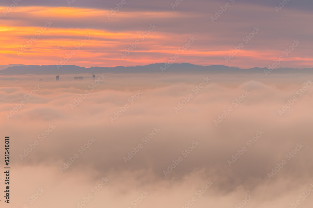 Morning fog covering downtown Vancouver at sunrise