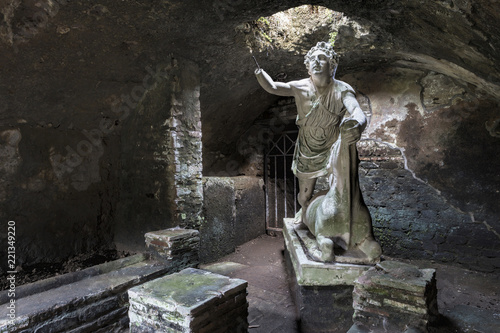Statue of the god Mithras killing a bull in the thermal s mithraeum in archaeological excavations of Antica Ostia