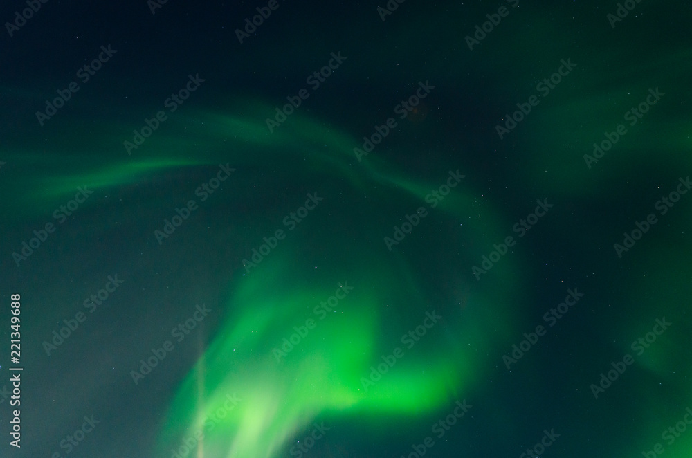 Fototapeta premium Aurora, Northern lights in the winter in the sky.