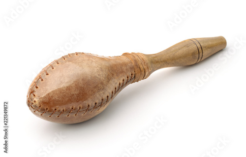 Traditional maraca made of leather and wood photo