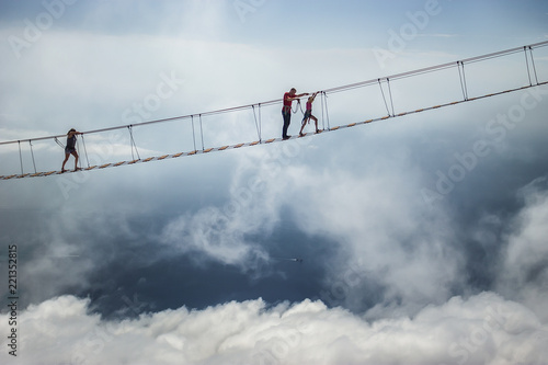 Tourist walking on rope bridge on the Mount Ai-Petri, Crimea
