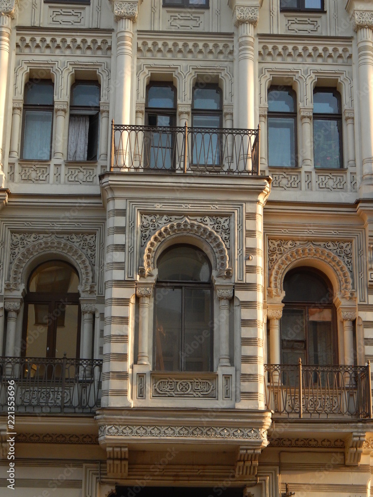 Fragment of the facade of the beautiful old house Muruzi in St. Petersburg, decorated with arches and oriental ornament