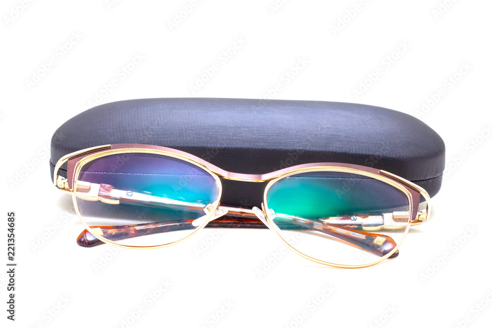 Sunglasses with spraying next to a black case Sunglasses with spraying next to a black case