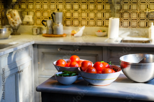 Tomatoes in a bowl on a counter in an Italian kitchen in Florence, Italy
